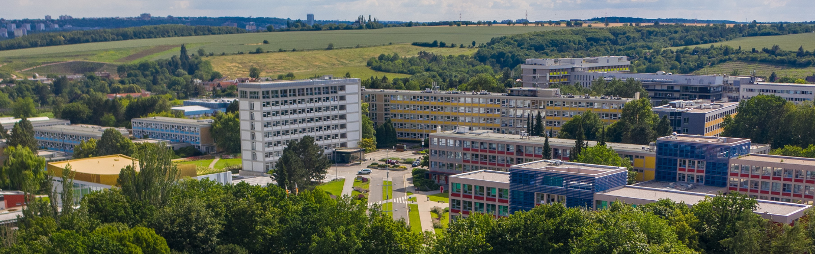Drone shot of the University campus, highlighting the modern architecture of the buildings.
